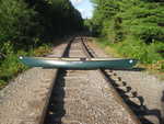 Portaging a canoe across railroad tracks