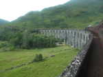 The Jacobite steam train chugging across the Glenfinnan Viaduct on its way to Hogwarts