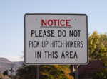 “Please do not pick up hitch-hikers” sign. Thankfully the trail went right through town, and I did not have to stick out my thumb here.