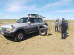 Changing a flat tire in the desert. This jeep ended up with a total of 10 flats throughout the trip.