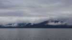 Clouds on the top of the fiord’s mountains