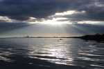 Sun shining through the clouds over Lake Naivasha