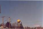 A water tower with a giant smiley face