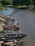 Fording the mighty river to reach the canoes