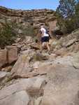 A runner climbing the ruff terrain